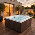 Spa Zen para 4 personas instalado en la terraza de una casa, con agua caliente y vapor