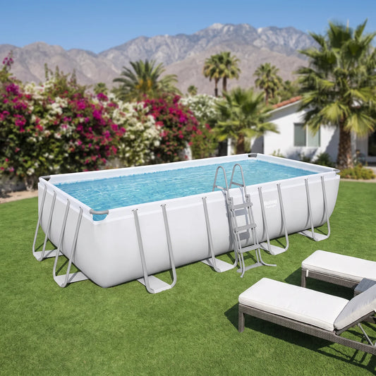 Piscina Bestway Power Steel 5,49 x 2,74 x 1,22 m armada en un patio con la cordillera de fondo